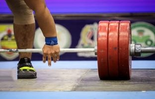 چرا پرچم ایران در مسابقات جهانی وزنه‌برداری نمایش داده نشد؟